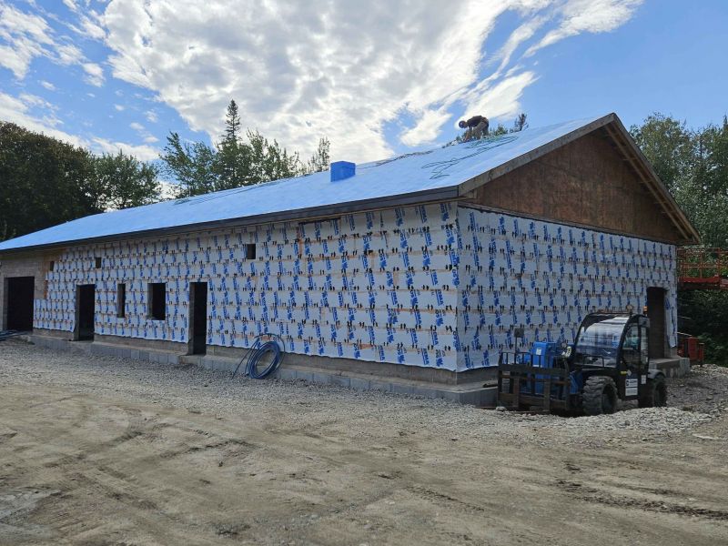 Long building with tyvec wrapped around it