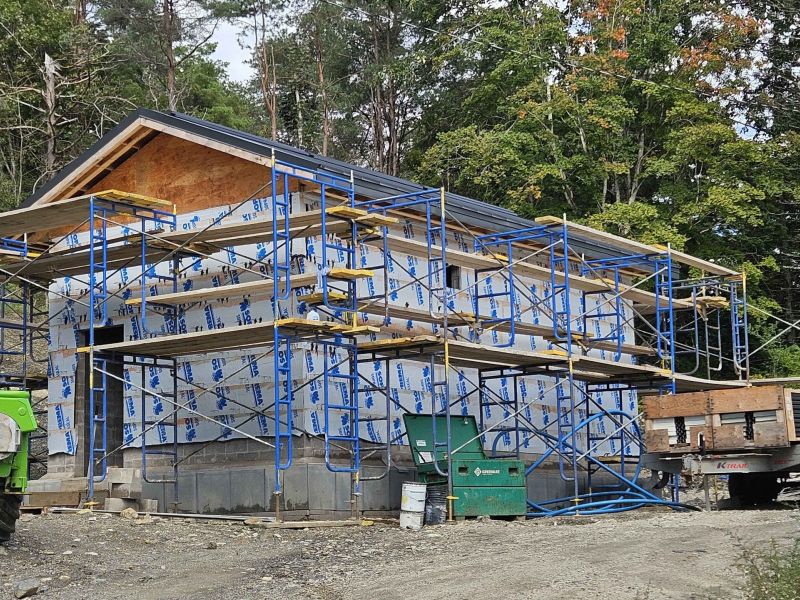 moderately sized building with scaffolding surrounding it