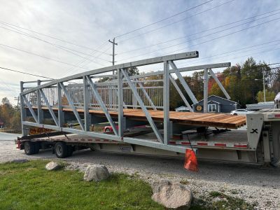 Span of trail bridge on a flatdeck